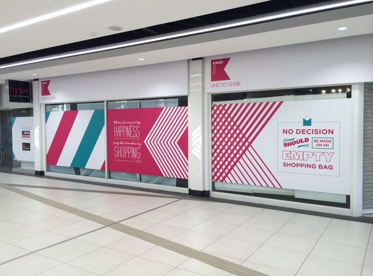 storefront with custom window graphics and branding