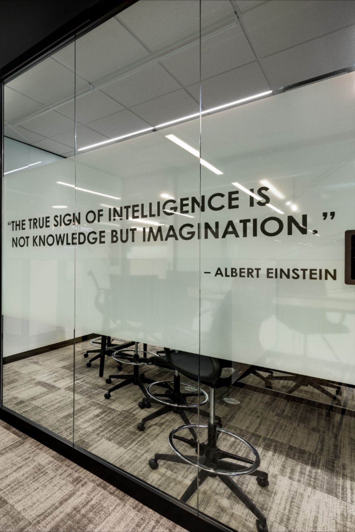 Application of vinyl window graphics using proper installation techniques.