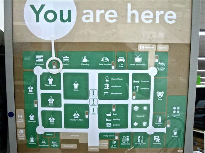 Interactive digital wayfinding kiosk showing map with you are here navigation in public space