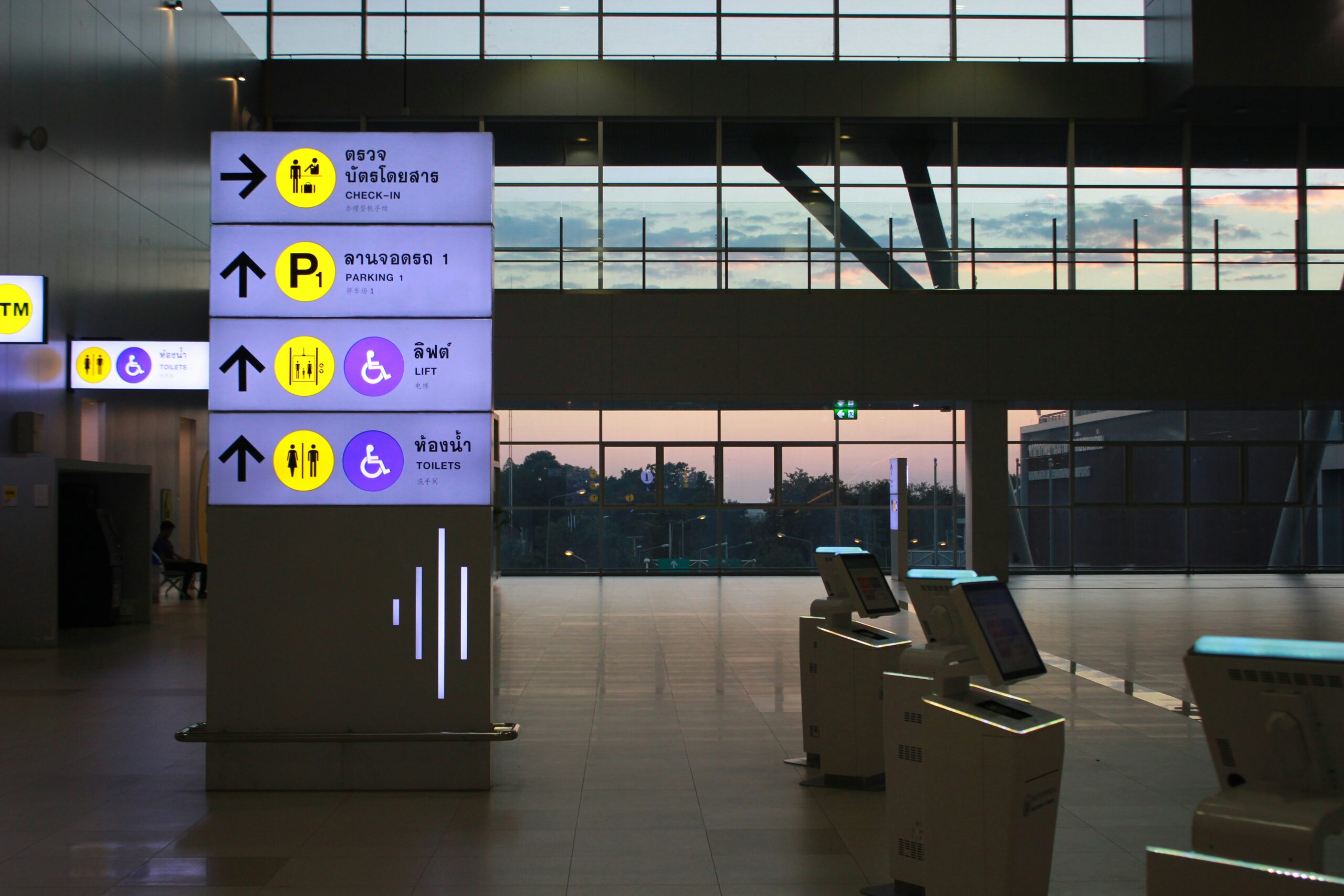 Modern office wayfinding display and directional signage installed in a hallway